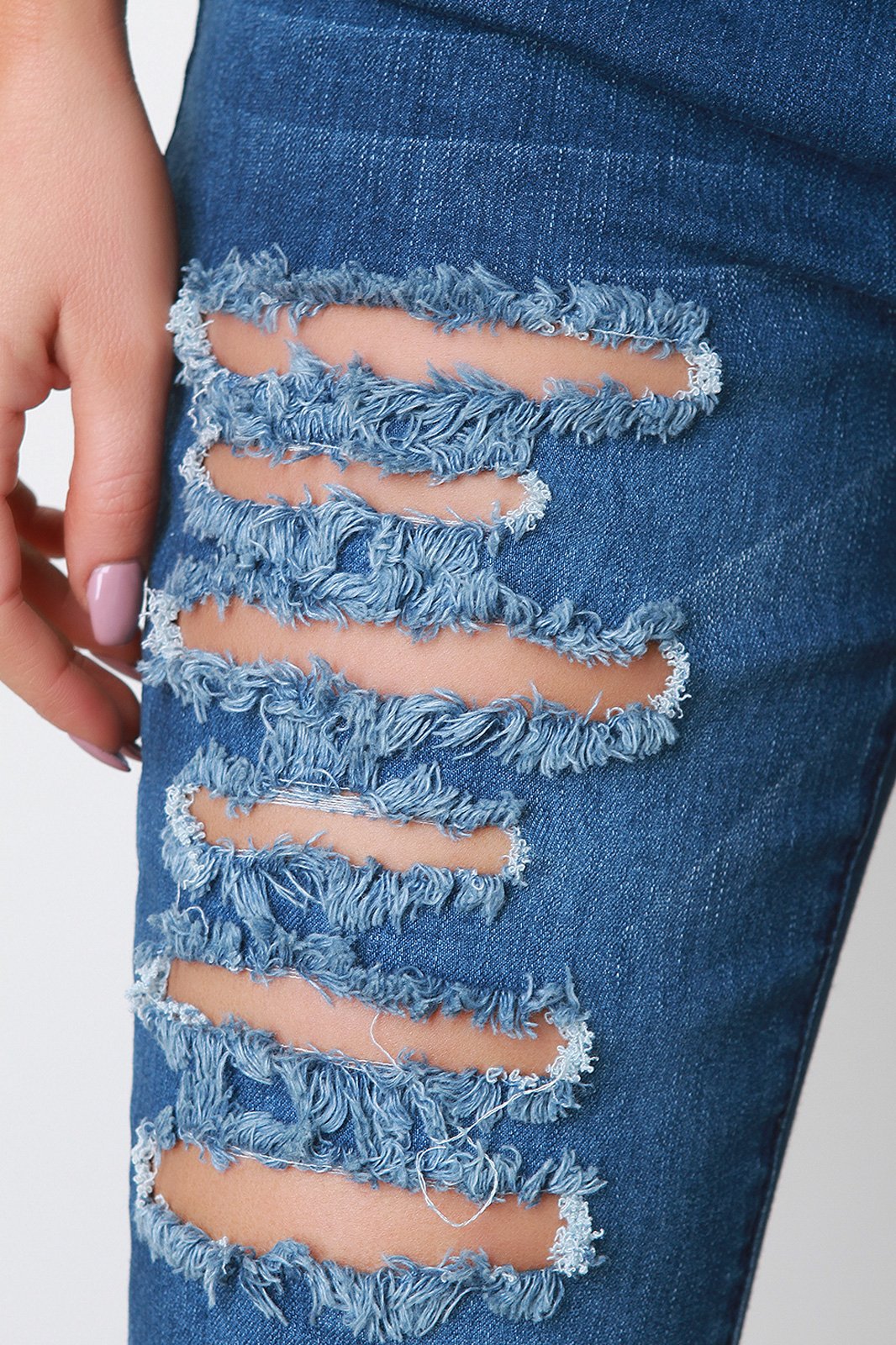 Mid Rise Destroyed Denim Skinny Jeans